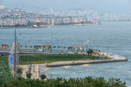 Konak Square street view with old clock tower at sunset. It was built in 1901 and accepted as the official symbol of Izmir City, Turkey.の写真素材