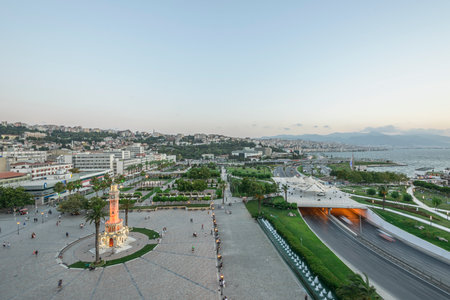 Konak Square street view with old clock tower (Clock Tower) at sunset. It was built in 1901 and accepted as the official symbol of Izmir City, Turkey.の写真素材