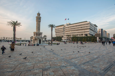 Konak Square street view with old clock tower (Clock Tower) at sunset. It was built in 1901 and accepted as the official symbol of Izmir City, Turkey.の写真素材