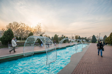 Konak Square street view with old clock tower at sunset. It was built in 1901 and accepted as the official symbol of Izmir City, Turkey.の写真素材