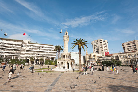Konak Square street view with old clock tower (Clock Tower) at sunset. It was built in 1901 and accepted as the official symbol of Izmir City, Turkey.の写真素材