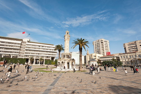 Konak Square street view with old clock tower (Clock Tower) at sunset. It was built in 1901 and accepted as the official symbol of Izmir City, Turkey.の写真素材