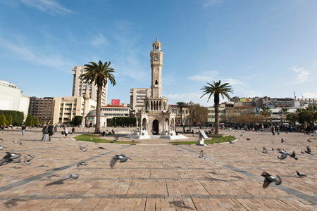 Konak Square street view with old clock tower (Clock Tower) at sunset. It was built in 1901 and accepted as the official symbol of Izmir City, Turkey.の写真素材