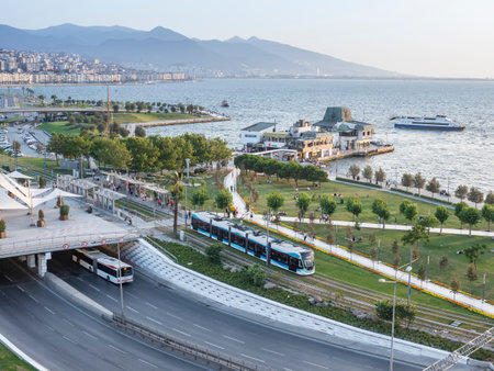 Konak Square street view with old clock tower (Clock Tower) at sunset. It was built in 1901 and accepted as the official symbol of Izmir City, Turkey.の写真素材