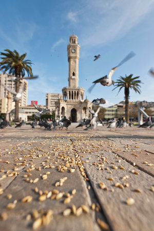Konak Square street view with old clock tower (Clock Tower) at sunset. It was built in 1901 and accepted as the official symbol of Izmir City, Turkey.の写真素材