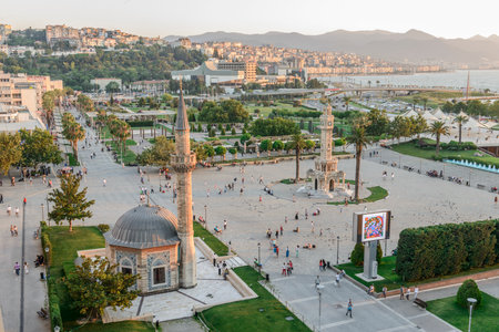 Konak Square street view with old clock tower (Clock Tower) at sunset. It was built in 1901 and accepted as the official symbol of Izmir City, Turkey.の写真素材