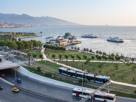 Konak Square street view with old clock tower (Clock Tower) at sunset. It was built in 1901 and accepted as the official symbol of Izmir City, Turkey.の写真素材