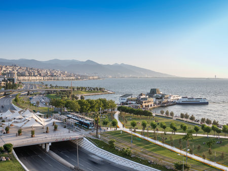 Konak Square street view with old clock tower at sunset. It was built in 1901 and accepted as the official symbol of Izmir City, Turkey.の写真素材