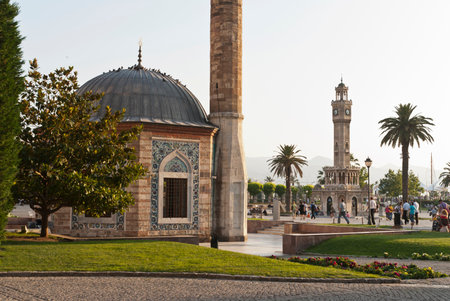 Konak Square street view with old clock tower (Clock Tower) at sunset. It was built in 1901 and accepted as the official symbol of Izmir City, Turkey.の写真素材