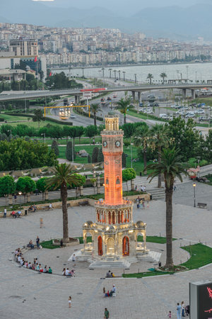 Konak Square street view with old clock tower (Clock Tower) at sunset. It was built in 1901 and accepted as the official symbol of Izmir City, Turkey.の写真素材