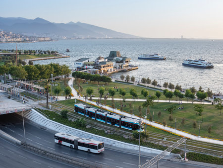 Konak Square street view with old clock tower (Clock Tower) at sunset. It was built in 1901 and accepted as the official symbol of Izmir City, Turkey.の写真素材