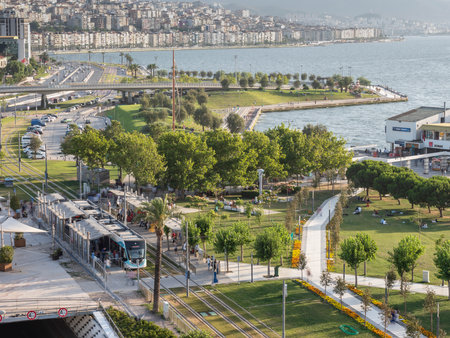 Konak Square street view with old clock tower (Clock Tower) at sunset. It was built in 1901 and accepted as the official symbol of Izmir City, Turkey.の写真素材