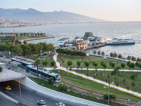 Konak Square street view with old clock tower (Clock Tower) at sunset. It was built in 1901 and accepted as the official symbol of Izmir City, Turkey.の写真素材