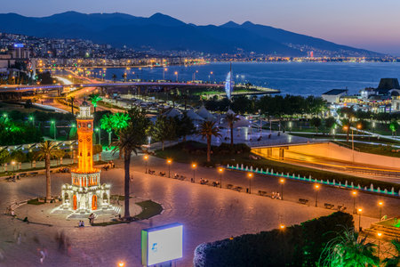 Konak Square street view with old clock tower (Clock Tower) at sunset. It was built in 1901 and accepted as the official symbol of Izmir City, Turkey.の写真素材