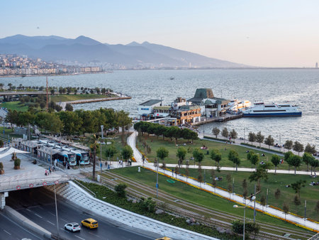 Konak Square street view with old clock tower (Clock Tower) at sunset. It was built in 1901 and accepted as the official symbol of Izmir City, Turkey.の写真素材
