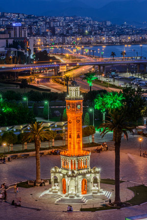 Konak Square street view with old clock tower (Clock Tower) at sunset. It was built in 1901 and accepted as the official symbol of Izmir City, Turkey.の写真素材