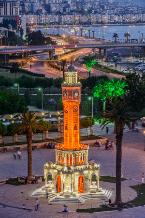 Konak Square street view with old clock tower (Clock Tower) at sunset. It was built in 1901 and accepted as the official symbol of Izmir City, Turkey.の写真素材