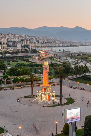 Konak Square street view with old clock tower (Clock Tower) at sunset. It was built in 1901 and accepted as the official symbol of Izmir City, Turkey.の写真素材