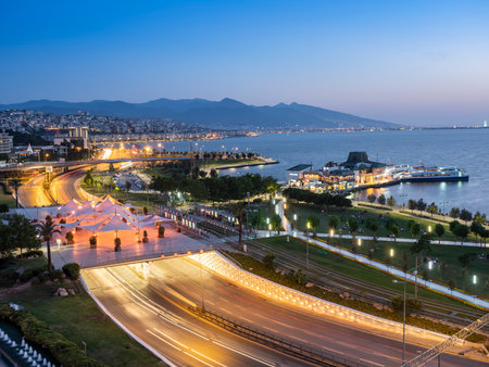 Konak Square street view with old clock tower (Clock Tower) at sunset. It was built in 1901 and accepted as the official symbol of Izmir City, Turkey.の写真素材