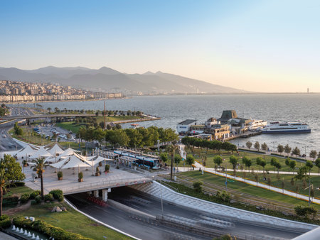 Konak Square street view with old clock tower (Clock Tower) at sunset. It was built in 1901 and accepted as the official symbol of Izmir City, Turkey.の写真素材