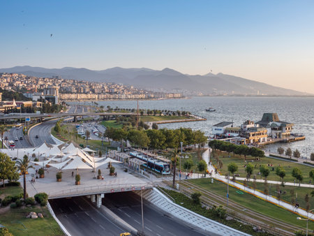 Konak Square street view with old clock tower at sunset. It was built in 1901 and accepted as the official symbol of Izmir City, Turkey.の写真素材