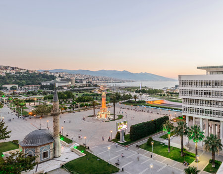 Konak Square street view with old clock tower (Clock Tower) at sunset. It was built in 1901 and accepted as the official symbol of Izmir City, Turkey.の写真素材