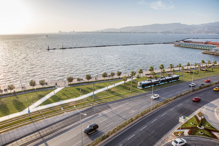 Konak Square street view with old clock tower (Clock Tower) at sunset. It was built in 1901 and accepted as the official symbol of Izmir City, Turkey.の写真素材
