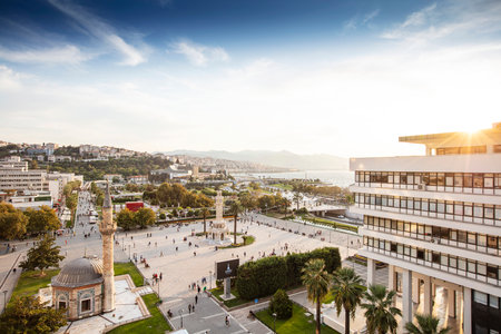 Konak Square street view with old clock tower (Clock Tower) at sunset. It was built in 1901 and accepted as the official symbol of Izmir City, Turkey.の写真素材