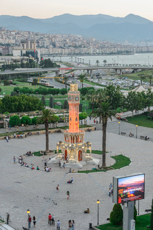 Konak Square street view with old clock tower (Clock Tower) at sunset. It was built in 1901 and accepted as the official symbol of Izmir City, Turkey.の写真素材