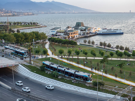 Konak Square street view with old clock tower (Clock Tower) at sunset. It was built in 1901 and accepted as the official symbol of Izmir City, Turkey.の写真素材