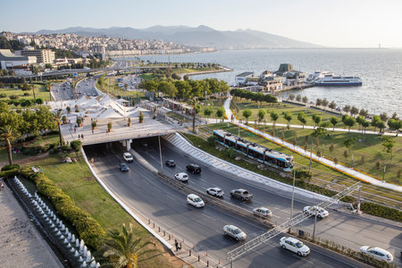Konak Square street view with old clock tower (Clock Tower) at sunset. It was built in 1901 and accepted as the official symbol of Izmir City, Turkey.の写真素材
