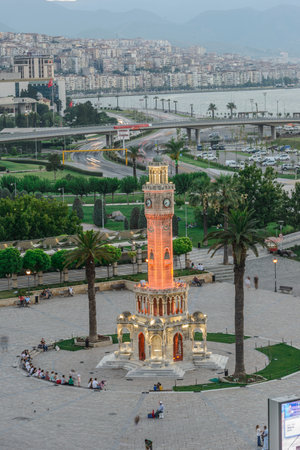 Konak Square street view with old clock tower (Clock Tower) at sunset. It was built in 1901 and...