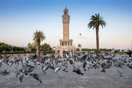 Konak Square street view with old clock tower (Clock Tower) at sunset. It was built in 1901 and accepted as the official symbol of Izmir City, Turkey.の写真素材