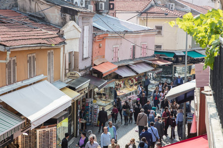 People on the street in Kemeralti district. Kemeralti (Kemeralti Carsisi) is a historical market (bazaar) district of Konak. Izmir, Turkeyの写真素材