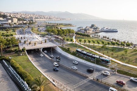 Konak Square street view with old clock tower (Clock Tower) at sunset. It was built in 1901 and accepted as the official symbol of Izmir City, Turkey.の写真素材