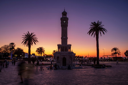 Konak Square street view with old clock tower (Clock Tower) at sunset. It was built in 1901 and accepted as the official symbol of Izmir City, Turkey.の写真素材