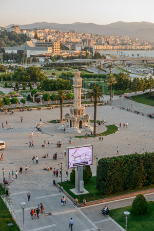 Konak Square street view with old clock tower (Clock Tower) at sunset. It was built in 1901 and accepted as the official symbol of Izmir City, Turkey.の写真素材