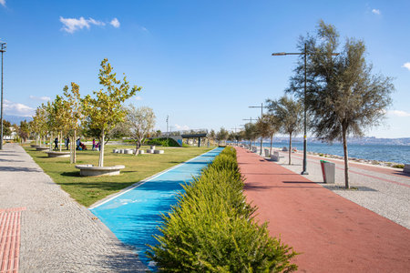 People doing sports in the morning on the Bostanli shore. Bostanli is a neighborhood of Karsiyaka province of Izmirの写真素材