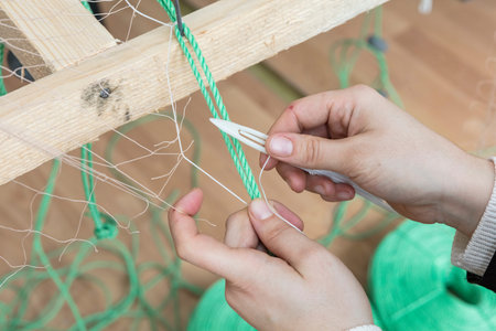 Fishermen knitting their net ,Close up