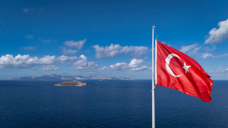 Turkish Flag Flying Over Kardak Rocks in Bodrum, Aegean Seaの写真素材