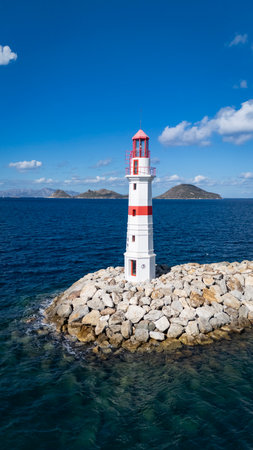 Red and White Lighthouse on Aegean Coast in Turgutreis, Bodrum, Turkeyの写真素材