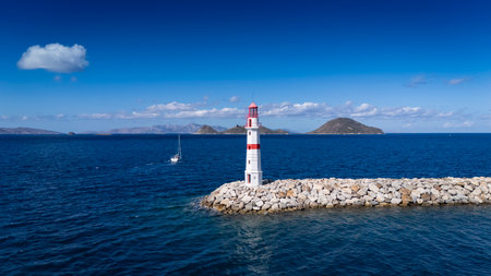 Red and White Lighthouse on Aegean Coast in Turgutreis, Bodrum, Turkeyの写真素材