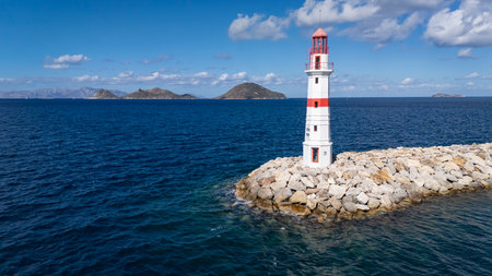 Red and White Lighthouse on Aegean Coast in Turgutreis, Bodrum, Turkeyの写真素材