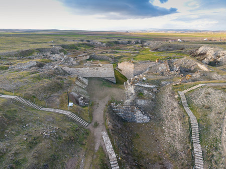 Aerial drone view of Gordion Ancient City near Polatli in Ankara, Turkey, featuring ancient ruins, the famous Tumulus of Midas, and the surrounding historical landscape from above.の写真素材