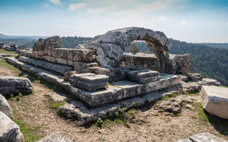 Ancient ruins of the Apollon Lairbenos Temple located on Asartepe Hill near Cal, Denizli, Turkey, overlooking the Buyuk Menderes Valley with scenic landscape and historical atmosphere.の写真素材