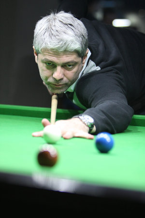 A snooker player concentrated
