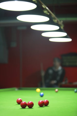 A  snooker player waiting his turn...の写真素材
