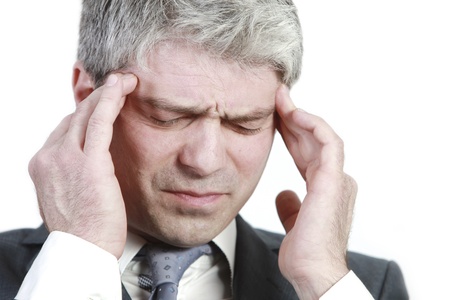 Businessman under pressure    having head ache   の写真素材