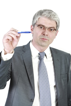 A young businessman indicating with his pen   isolated on white background   の写真素材