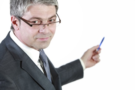 Handsome young businessman shows    with his pen  Isolated on white background   の写真素材